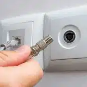Do electricians install coax cable outlets and mount TVs